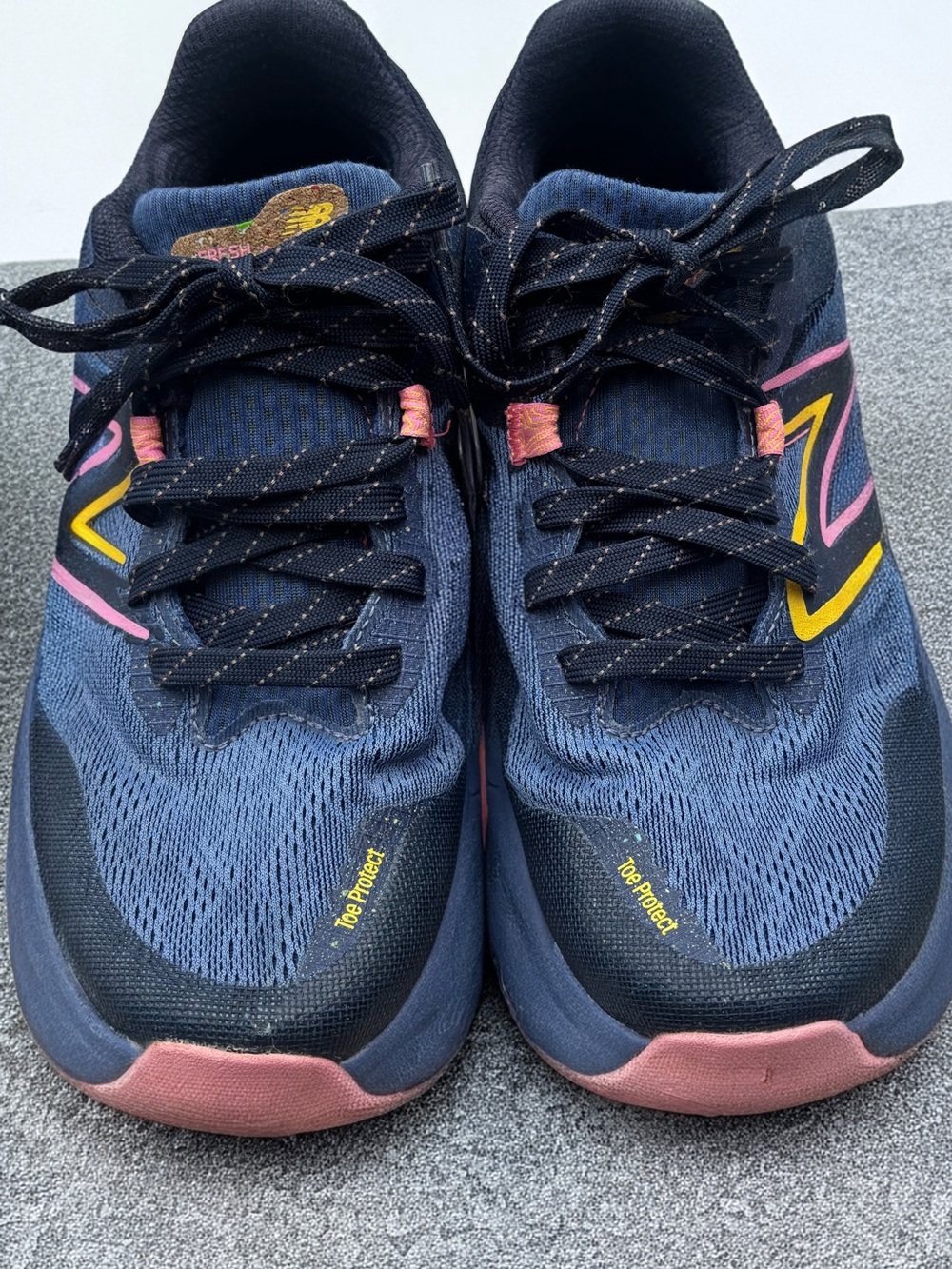 New Balance Navy Sneakers with Pink and Yellow Accents